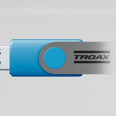 Blue and silver Troax branded USB flash drive, showcasing the company's corporate promotional merchandise