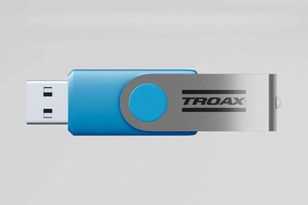 Blue and silver Troax branded USB flash drive, showcasing the company's corporate promotional merchandise